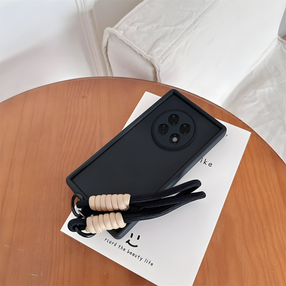 Oppo F31 Pro Plus 5G Black phone case with a lanyard on a wooden table