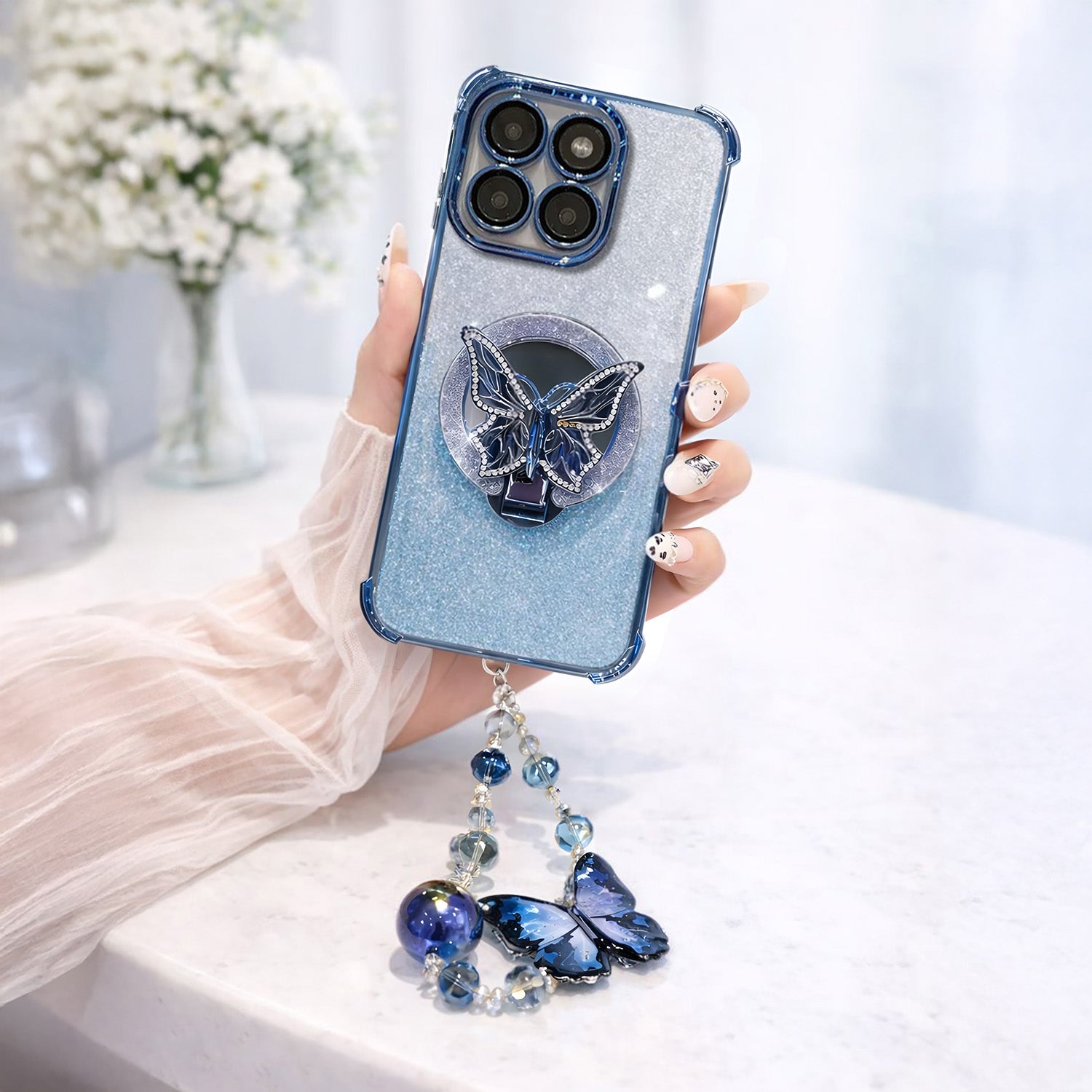 Motorola Edge 60 Pro 5G Phone case with butterfly design and decorative chain held by a hand.