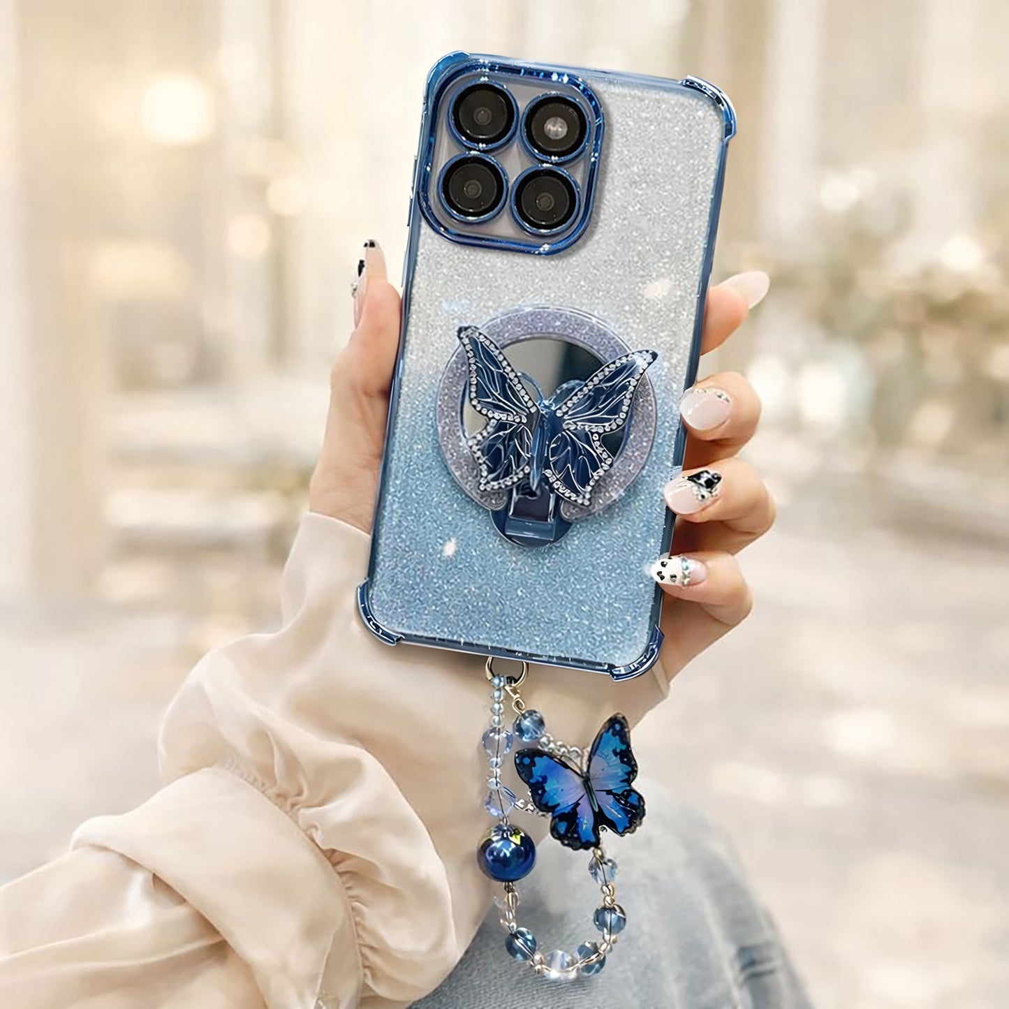 Blue glittery Motorola Edge 60 Pro 5G phone case with butterfly design held by a person