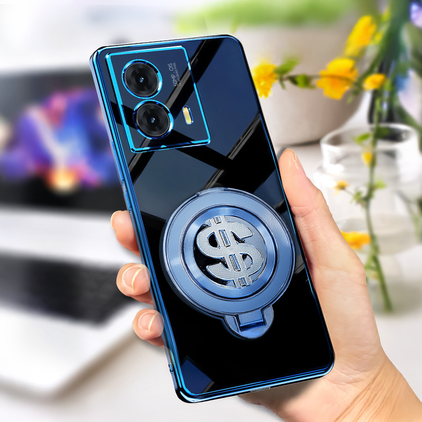 Motorola Moto G85 5G Phone case with ring holder and dollar sign design held by a hand, blurred indoor background