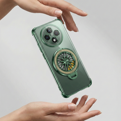 Green phone case with a decorative ring holder held by a hand on a light gray background
