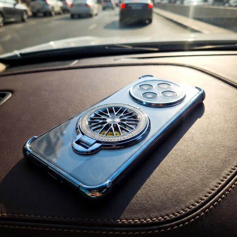 Phone case with wheel design on a car dashboard