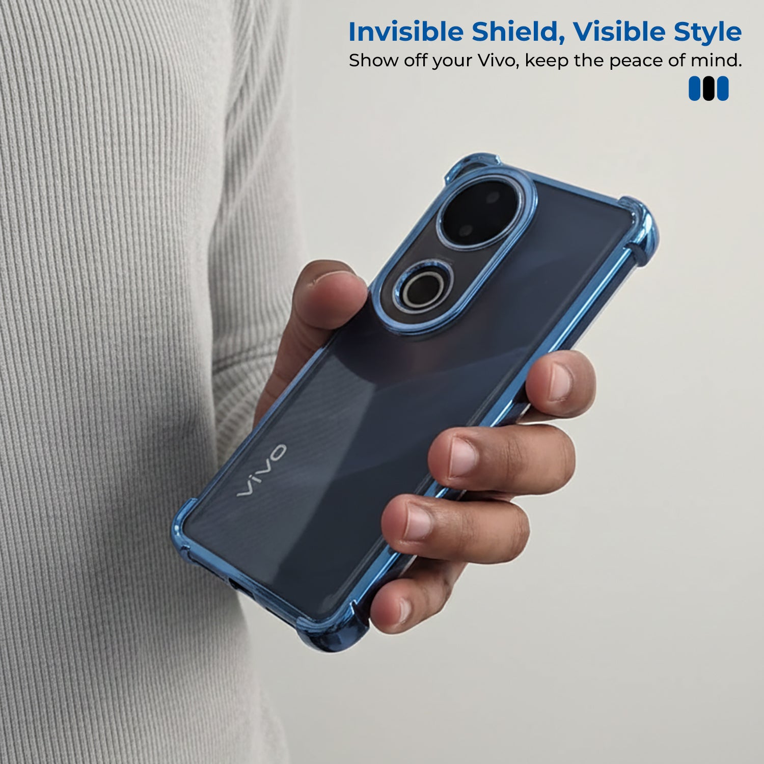 Person holding a Vivo V50 5G phone with a blue case, promotional text about 'Invisible Shield, Visible Style' on a light gray background.