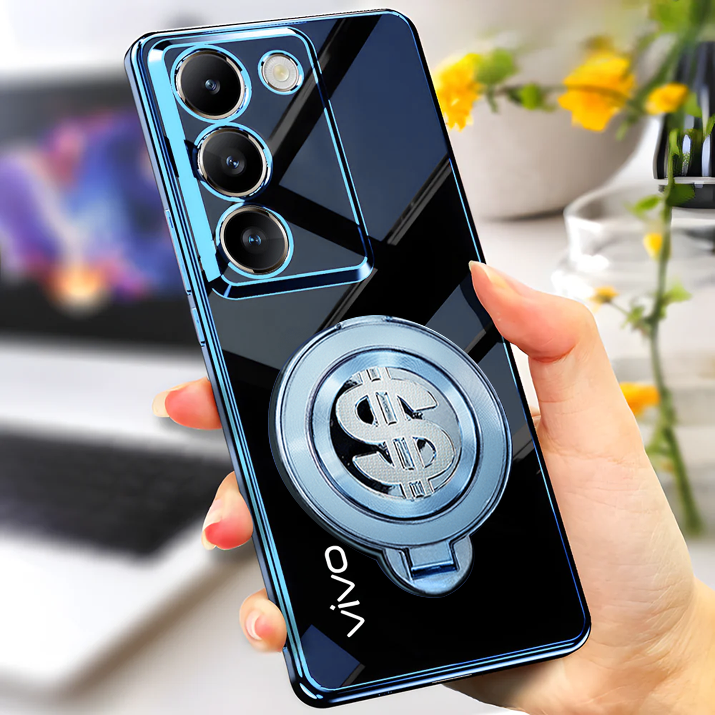 Phone case with dollar sign design held by a hand, blurred background