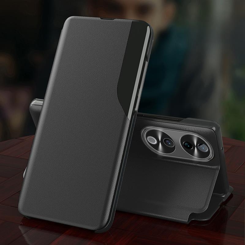 Black phone case with stand feature on a wooden surface