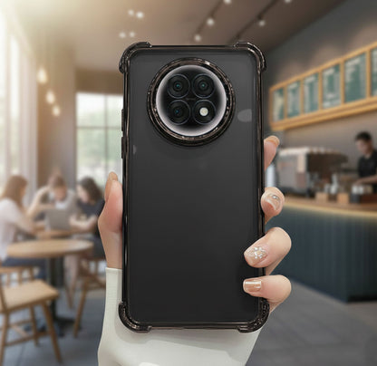 Person holding a Oppo F31 Pro Plus 5G black phone case with a blurred cafe background